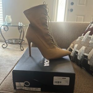 Walking out on you heeled booties in cosmic nude